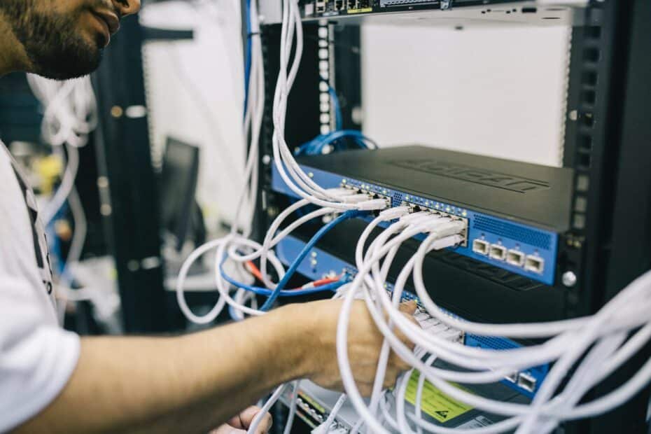 electronics engineer fixing cables on server